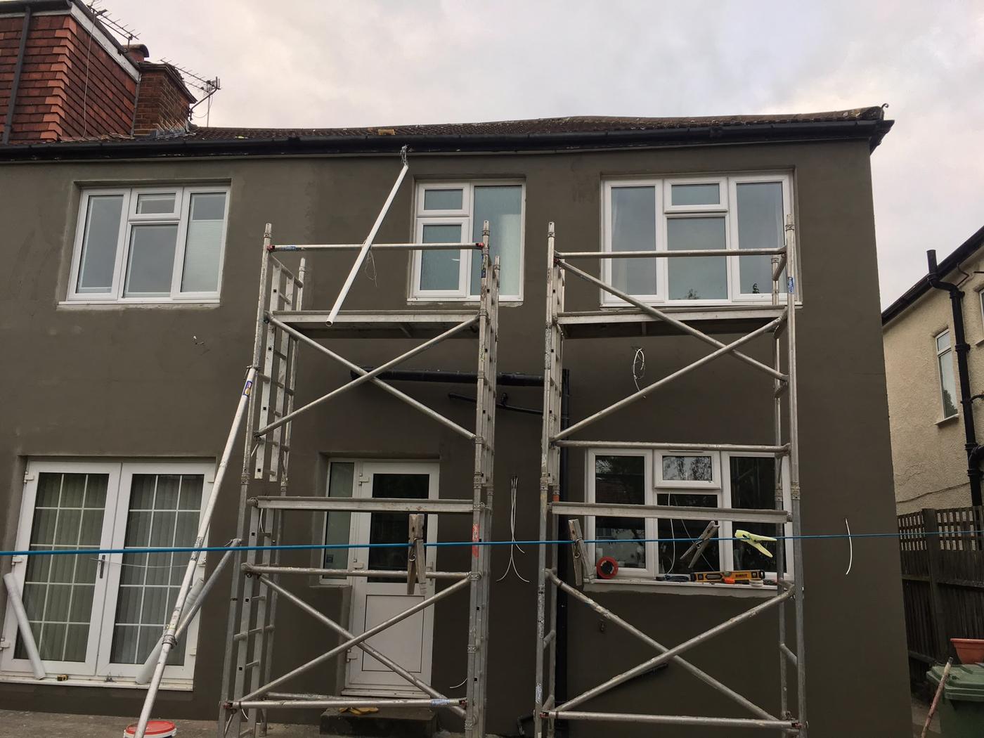 Rear elevation of a house with new external wall insulation and base-coat render