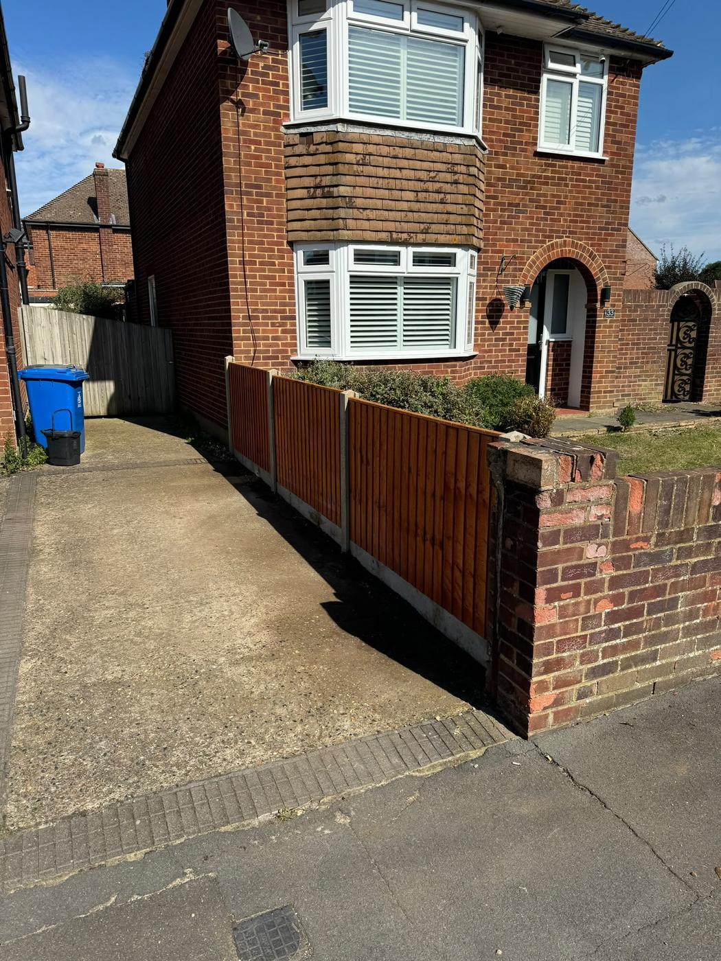 Front garden fence with concrete posts and gravel boards
